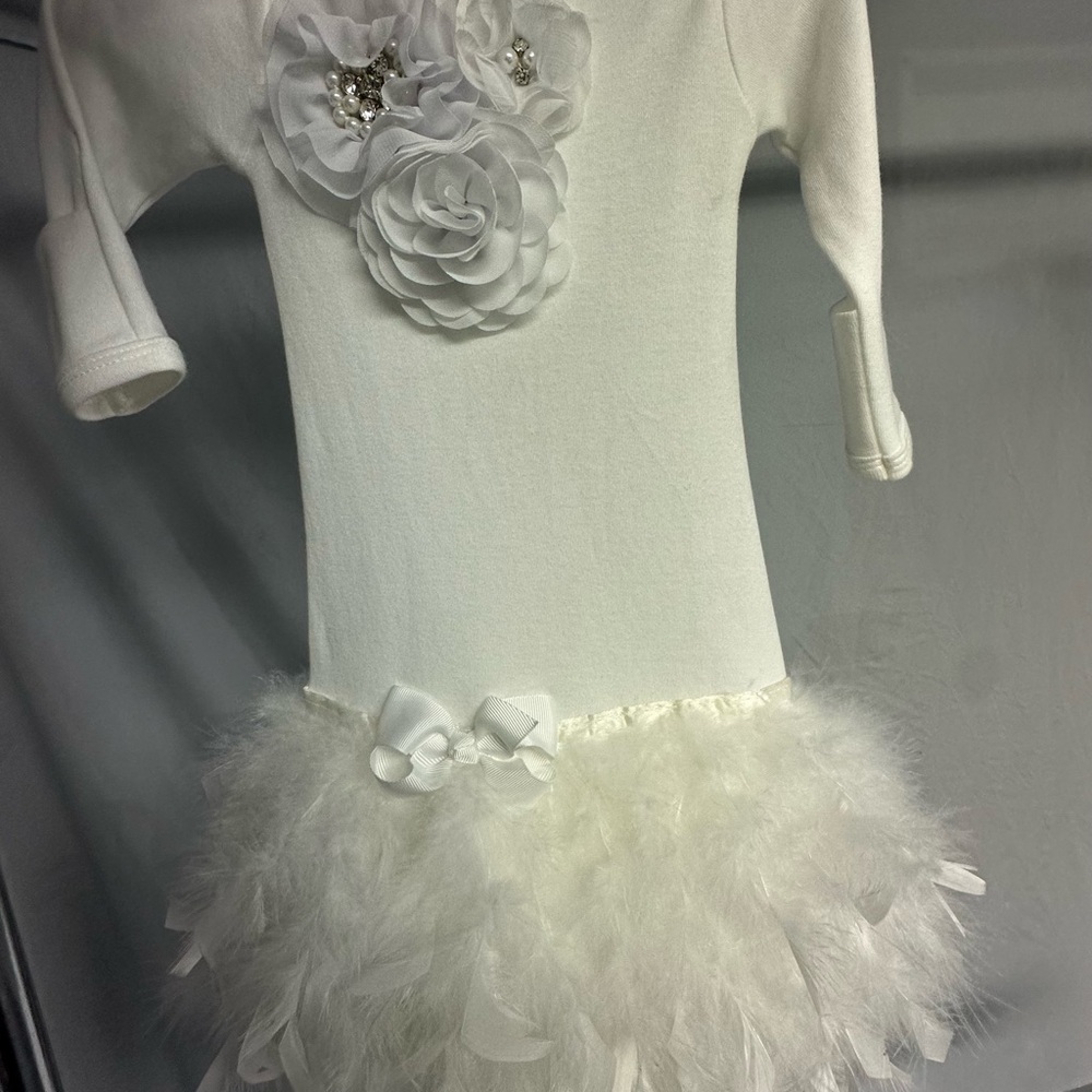 Elegant White Dress with Floral and Feather Details